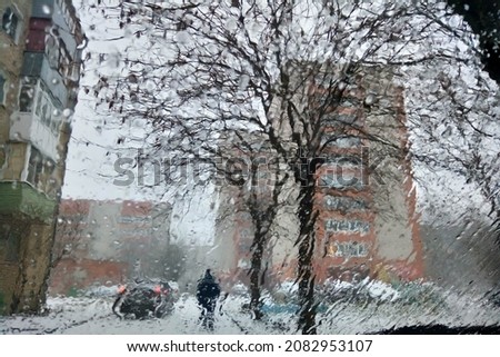 Meteorology, the form of precipitation. Precipitation in the form of wet snow, showers with wet snow. Snow cover. Thick heavy snowfall is coming Royalty-Free Stock Photo #2082953107
