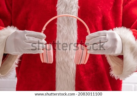 santa claus hands with headphones