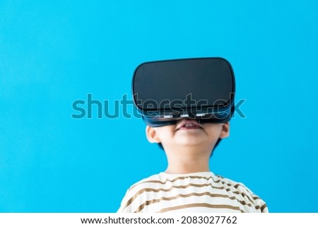 kid child toddler boy playing game on virtual reality vr glasses.future digital technology. kid toddler boy play VR virtual.future technology.Online learning education student with innovation tech.
