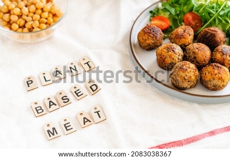 Vegan veggie meatballs on the plate with fresh salad. Pea protein ingredients on the background. Plant based meat concept.Vegetarian lunch. Healthy eating. Go vegan. Selective focus. Royalty-Free Stock Photo #2083038367