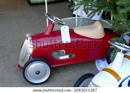 Shiny, red scooter for toddler at Christmas