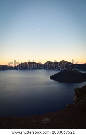 Beautiful landscape during sunset at Crater Lake National Park with beautiful sky colors 