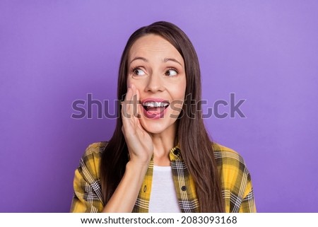 Photo of sweet young lady tell secret wear plaid shirt isolated on purple color background