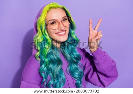 Photo of youngster lady geek with turquoise haircut make v-sign isolated over violet color background Royalty-Free Stock Photo #2083093702