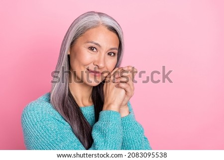 Photo of mature peaceful woman with perfect aged skin flawless skincare routine isolated on pink color background