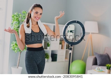 Photo of confident charming young lady wear sport outfit smiling showing online training indoors home house