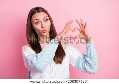 Photo of flirty funky happy lady make hands heart send air kiss good mood isolated on pink color background