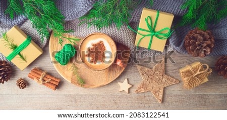 Hygge Scandinavian style concept with coffee cup and eco friendly decorations on wooden background. Cozy winter Christmas top view composition