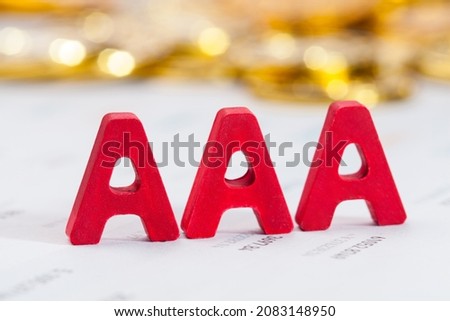 close up of AAA credit rating letters on financial document. Royalty-Free Stock Photo #2083148950