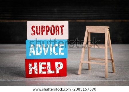 Support, Advice and Help Concept. Colored wooden blocks in a pile and stairs.