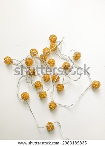 Christmas garlands in the style of minimalism on a white background. fuzzy Christmas background, attributes of decorations on the Christmas tree