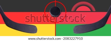Top view hockey puck with Germany vs. Malawi command with the sticks on the flag. Concept hockey competitions