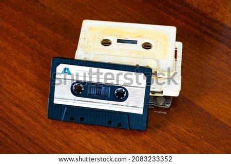Old Audio Tape Cassettes on a Wooden Table Background closeup