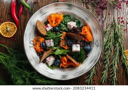 healthy fresh salad with pumpkin and feta cheese 