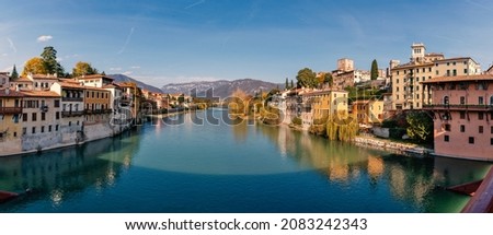 Bassano del Grappa panoramic view in a sunny day from Old wooden bridge. High resolution image made by different photos stitched together. Royalty-Free Stock Photo #2083242343
