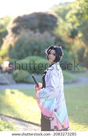 Portrait of a girl with a costume in the Japanese theme garden