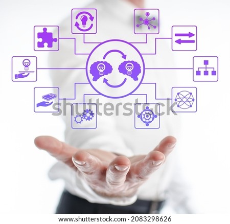 Knowledge sharing concept levitating above a hand of a man