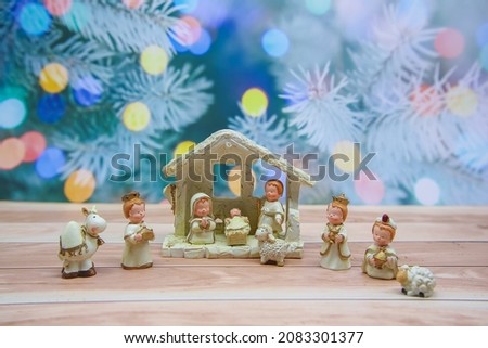 Christmas Manger Nativity scene with figurines including Baby Jesus, Virgin Mary and Saint  Joseph