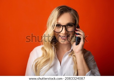 phone call to an adult female with makeup and glasses 
