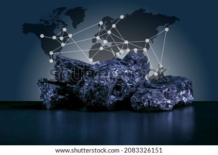 Supply coal resources around the world. Heap of coal on world maps background. Royalty-Free Stock Photo #2083326151