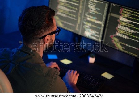 Profile photo of clever young programmer look two monitors optimization html midnight business center
