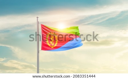 Eritrea national flag waving in beautiful sky.