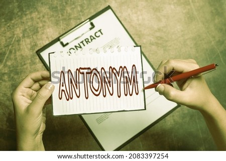 Text caption presenting Antonym. Business overview word or phrase whose meaning is the opposite of another word Writing New Ideas Telling Message And Informations Taking Important Notes