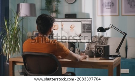 3D designer creating videogame character Royalty-Free Stock Photo #2083397704