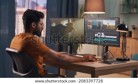 Man editing video on computer