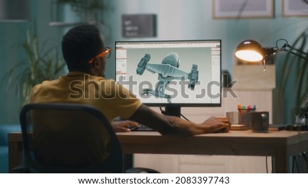 3D designer creating aircraft model for videogame Royalty-Free Stock Photo #2083397743