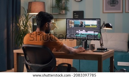 Man editing video on computer