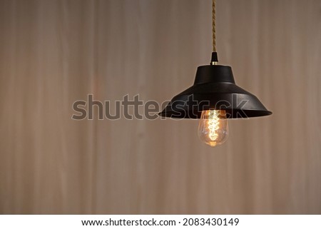 background light bulb with soft wood texture as background