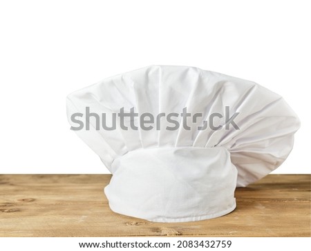 Chef's hat on table with isolated background