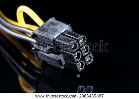 Computer connector on a black background for the functioning of digital equipment and data transmission close-up macro photography