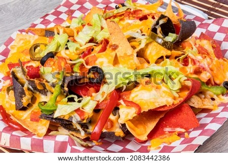 Colorful nachos on red checkered paper