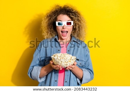 Photo of crazy funky lady hold bowl popcorn watch movie wear 3d glasses jeans shirt isolated yellow color background