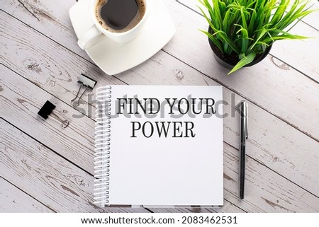 Cofee cup, notepad,pen on the wooden background. Business concept. Text FIND YOUR POWER