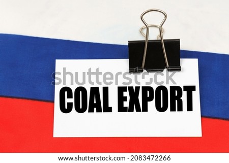 On the flag of Russia there is a business card with the inscription - Coal export