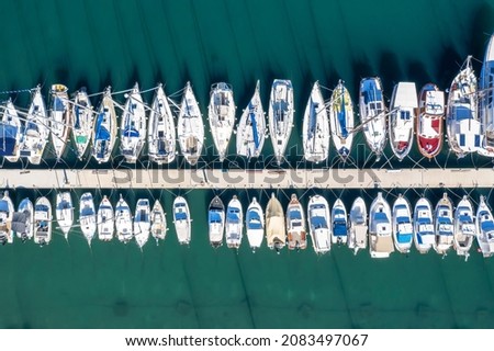 yachts and boats moored in the harbor, aerial shot, top view