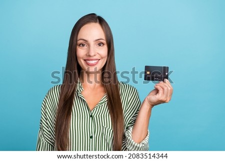 Photo of pretty mature lady show bank card promoter advertising profit salary isolated over blue color background