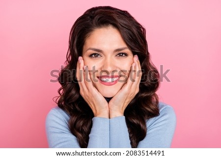 Photo of sweet charming woman wear blue sweater smiling arms cheeks isolated pink color background