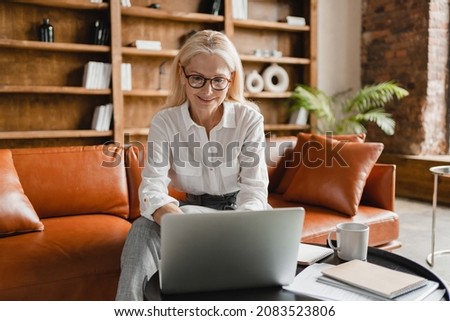 Caucasian businesswoman CEO leader freelancer teaching, working remotely on laptop, doing online shopping, e-learning, e-commerce concept from home.