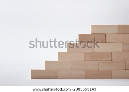 Wooden block steps on a gray background. Wall. Concept. Rise up. Height. Promotion.  ladder. Stairs.