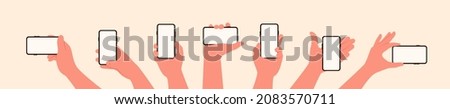 Hand hold the mobile phone in horizontal and vertical position with blank screen in different positions vector illustration set in flat style isolated Royalty-Free Stock Photo #2083570711