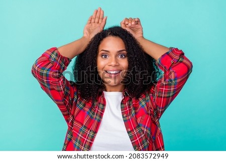 Photo of young pretty african woman have fun arms ears animal playful isolated over teal color background