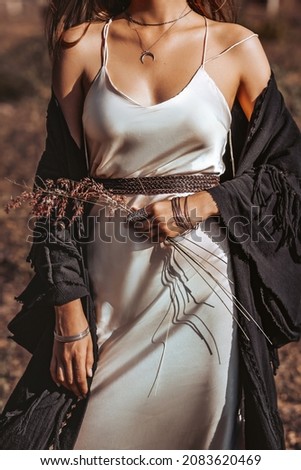 beautiful young stylish fashionable woman on the field at sunset close up portrait