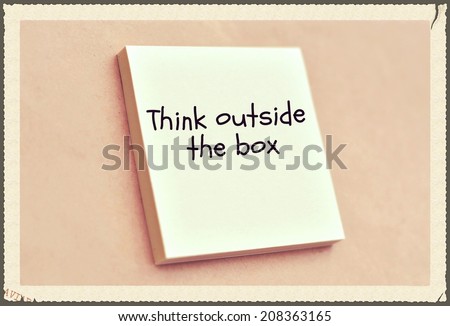 Text think outside the box on the short note texture background