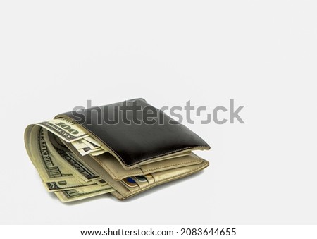 Old black wallet with dollar  isolated on white background