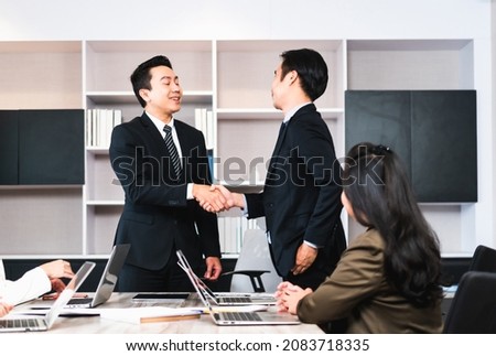 Success and happiness teamwork concept, Businessman handshake finishing up a meeting business partnership after good deal