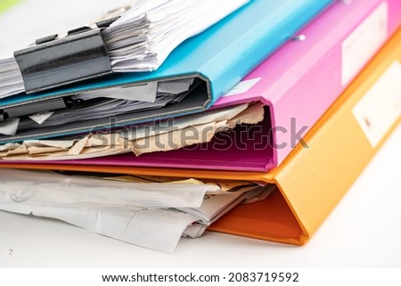 File Folder Binder stack of multi color on table in business office. Royalty-Free Stock Photo #2083719592
